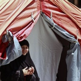 A Syrian refugee looks out from a medical tent at a refugee camp in the Turkish border town of Yayladagi in Hatay province July 1, 2011