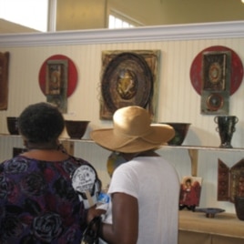 Visitors check out Lori Gordon's work at Gallery 220 in Bay St. Louis, Mississippi.