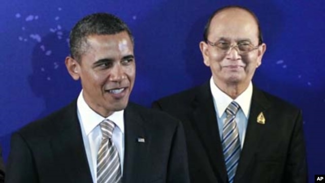President Barack Obama, left, stands with Myanmar President Thein Sein during a group photo session at the East Asia Summit in Bali, Indonesia, November 19, 2011.