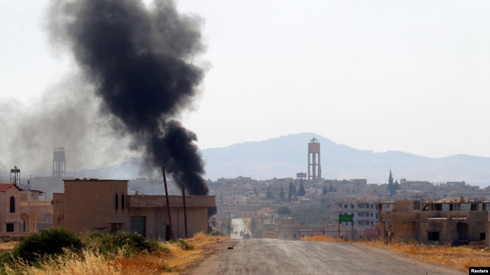 Smoke rises from Taybat al Imam town after rebel fighters from the hardline jihadist Jund al-Aqsa advanced in the town in Hama province, Syria August 31, 2016. 