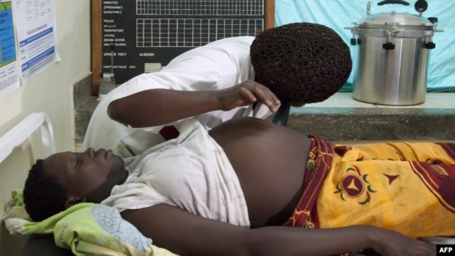 FILE - A pregnant woman in Uganda, September 27, 2011.