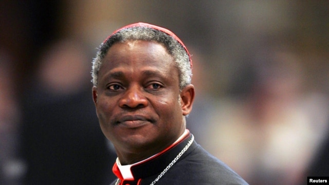 Cardinal Peter Kodwo Appiah Turkson of Ghana arrives to attend a mass led by bishop Leonardo Sandri of Argentina in St. Peter's Basilica at the Vatican, April 13, 2005.