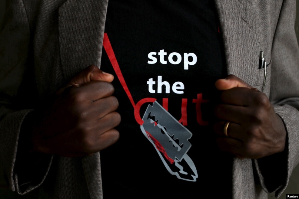 FILE - A T-shirt warns against female genital mutilation. Its wearer attends an event, discouraging harmful practices such as FGM, at a girls high school in Imbirikani, Kenya, April 21, 2016.