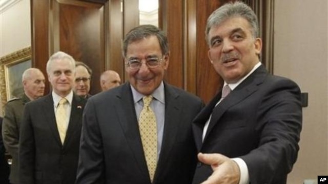 U.S. Sec. of Defense Leon Panetta, center, is greeted by Turkish President Abdullah Gul, right, before the start of their meeting in Ankara, Turkey,  Dec., 16, 2011.