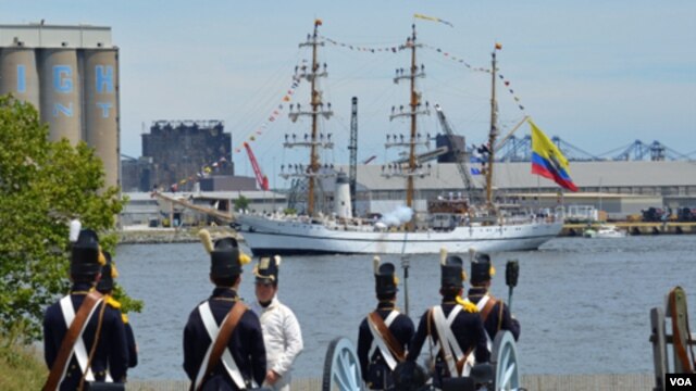 To kick off the 200th anniversary of the War of 1812, ships from around the world sailed past Fort McHenry and exchanged cannon fire with re-enactors on land, but it was all for show. (S. Logue/VOA)
