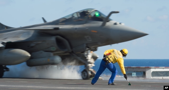 Photo, released Nov. 23, 2015 by the French Army Communications Audiovisual office (ECPAD), shows a French army Rafale fighter jet taking off from the deck of France's aircraft carrier Charles De Gaulle, in the Mediterranean sea.