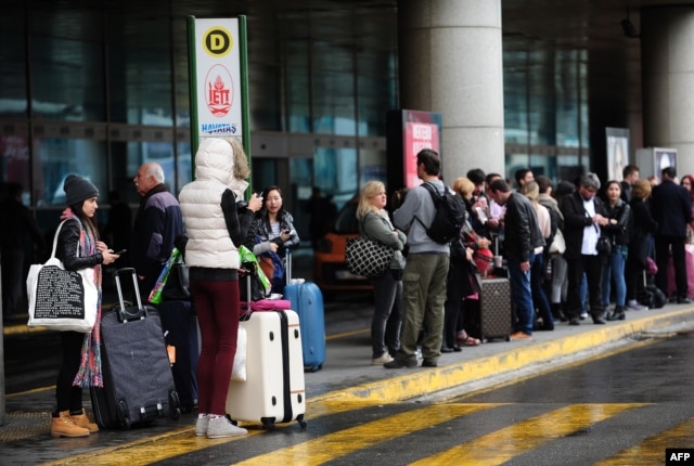 FILE - People wait in front of Ataturk airport in Istanbul, Turkey, March 31, 2015. Turkey advised its citizens to delay non-urgent travel to Russia, one of the moves made in a diplomatic spat over the downing of a Russian warplane last November.