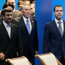 Front row from left, Iranian President Ahmadinejad, Kazakhstan's President Nazarbayev and Russian President Medvedev walk after a meeting of the Shanghai Cooperation Organization in Kazakhstan's capital Astana, June 15, 2011