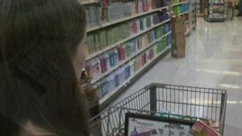 Laura Harders says using coupons can cut her grocery bill in half 