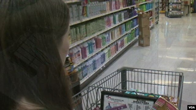 Laura Harders says using coupons can cut her grocery bill in half 