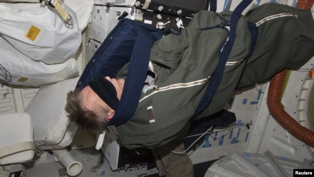 Astronaut Piers Sellers, STS-132 rests in his sleeping bag on the middeck of the space shuttle Atlantis in this photo provided by NASA and taken May 17, 2010.