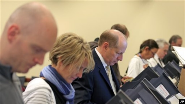 Voters at their voting machines at the Utah State Capitol Tuesday, Nov. 6, 2012, in Salt Lake City.  
