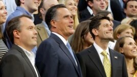 Mitt Romney, vice-presidential candidate Paul Ryan (R) and Campaign Manager Matt Rhoades pose for a staff portrait on the steps of the stage at the Republican National Convention, August 30, 2012.