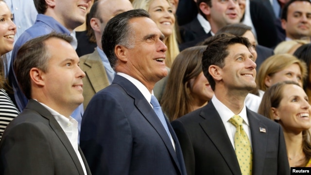 Mitt Romney, vice-presidential candidate Paul Ryan (R) and Campaign Manager Matt Rhoades pose for a staff portrait on the steps of the stage at the Republican National Convention, August 30, 2012.