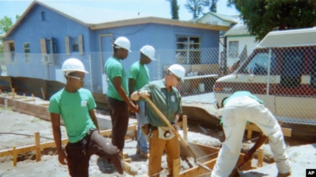 Students in the Eagle Nest Construction Academy work on the foundation of a home which will house a low-income family next year.