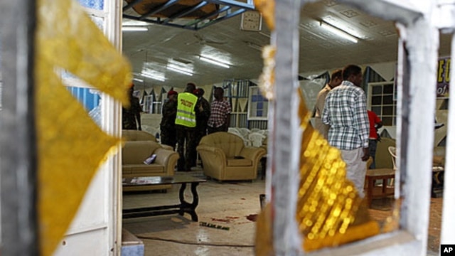 Detectives inspect the scene of an explosion inside the God's House of Miracles International Church in Nairobi, site of the April 29, 2012 grenade attack.