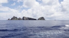 A group of disputed islands known as Senkaku in Japan and Diaoyu in China is seen from the city government of Tokyo's survey vessel in the East China Sea, September 2, 2012.