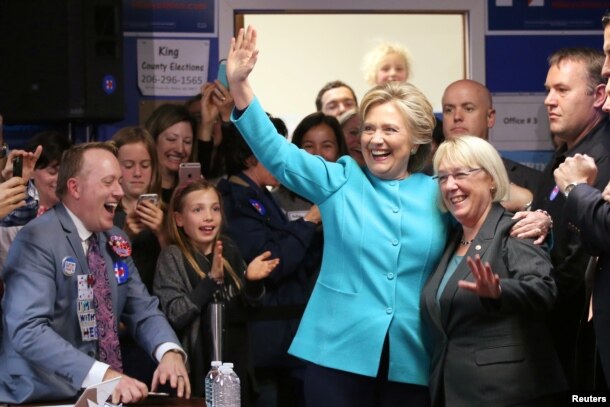 U.S. Democratic presidential nominee Hillary Clinton greets people at a campaign office in Seattle, Washington, Oct. 14, 2016.