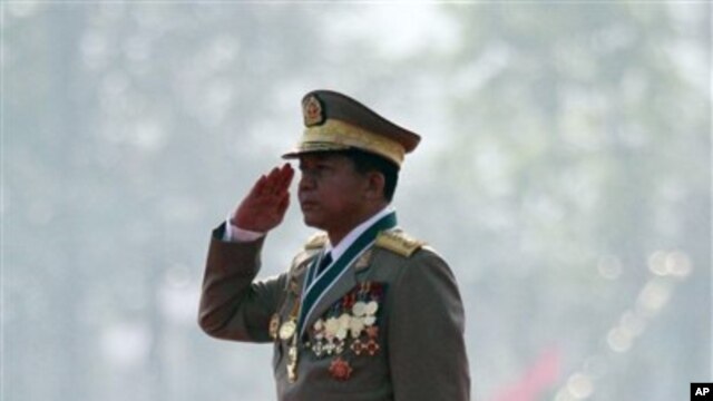 Burmese Gen. Min Aung Hlaing salutes the national flag during a ceremony marking the country's 67th Armed Forces Day in Naypyitaw, Burma, March 27, 2012. 