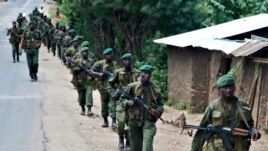 FILE - Congolese soldiers patrol the town of Rutshuru in eastern Congo, January 28, 2009. 