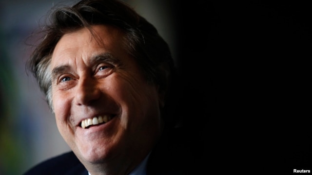 FILE - English singer Bryan Ferry smiles during an interview in Berlin, October 12, 2010. 
