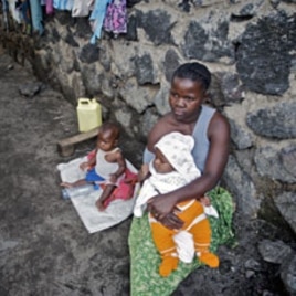 A woman looks after her two babies after being abandoned by her husband for being raped, in Goma (File)