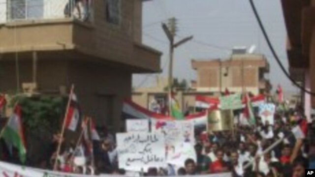 Demonstrators protesting against Syria's President Bashar al-Assad march through the streets after Friday's Prayers in Amude, September 30, 2011.