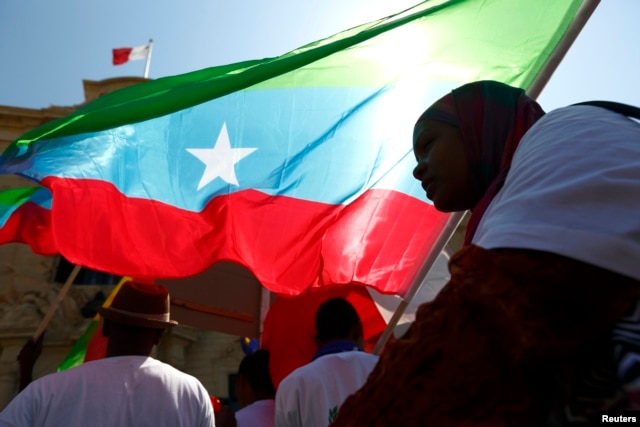 FILE - Members of the Oromo community of Ethiopia, living in Malta, protest against the Ethiopian regime and its plan to displace Oromo farmers outside the office of Malta's Prime Minister in Valletta, June 16, 2014.