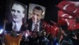Supporters hold portraits of Mustafa Kemal Ataturk, founder of Turkey and Turkish Prime Minister Recep Tayyip Erdogan at the Ataturk Airport of Istanbul early Friday.