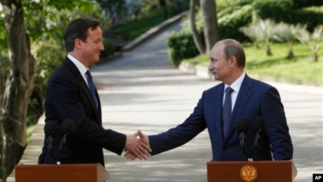 Thủ tướng Anh David Cameron (trái) và Tổng thống Nga Vladimir Putin cho biết họ quyết tâm hợp tác với nhau để chấm dứt vụ đổ máu ở Syria.