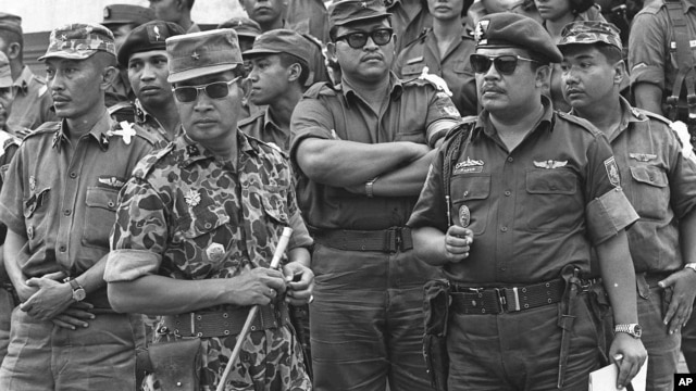 Maj. Gen. Suharto, 2nd left with sunglasses, is shown in this Oct. 6, 1965 file photo. The late dictator was an army general who crushed Indonesia's communist movement and pushed aside the country's founding father to usher in 32 years of tough rule.