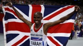 Britain's Mo Farah holds the Union Flag after winning the men's 10,000m final at the London 2012 Olympic Games at the Olympic Stadium August 4, 2012.