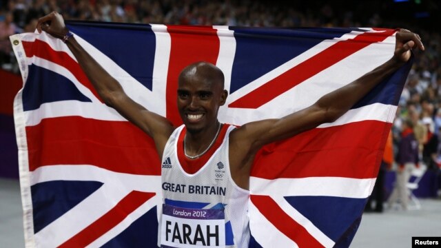 Britain's Mo Farah holds the Union Flag after winning the men's 10,000m final at the London 2012 Olympic Games at the Olympic Stadium August 4, 2012.