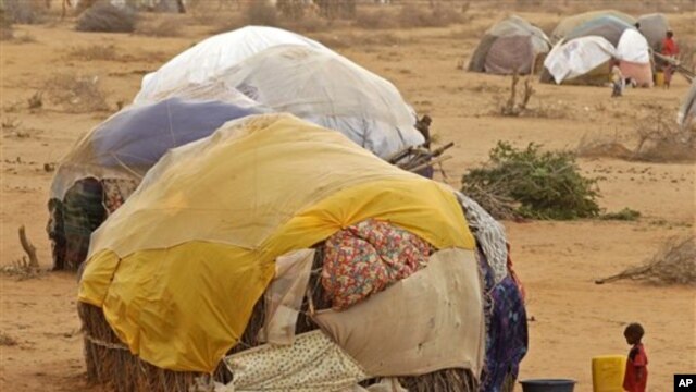 A child stands in front of her home at a refugee camp in Dadaab, Kenya, Thursday, Aug 4, 2011.