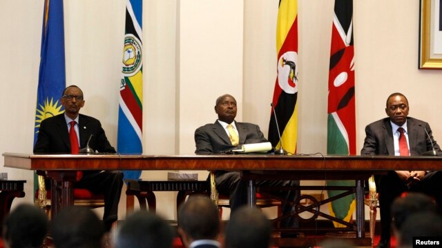 Three East African presidents, (from R) Uhuru Kenyatta of Kenya, Yoweri Museveni of Uganda and Paul Kagame of Rwanda, hold a joint news conference soon after their meeting in Entebbe, 36km (22 miles) southwest of the capital Kampala, June 25, 2013.
