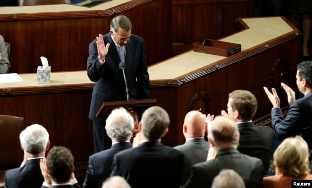 Outgoing House Speaker John Boehner departs the podium during a standing ovation after he addressed colleagues during the election for the new Speaker of the U.S. House of Representatives in the House Chamber in Washington, Oct. 29, 2015.