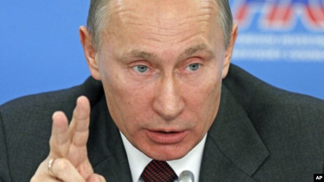 Russian Prime Minister Vladimir Putin gestures as he talks at a meeting of an investment advisory panel in Moscow, October 17, 2011.