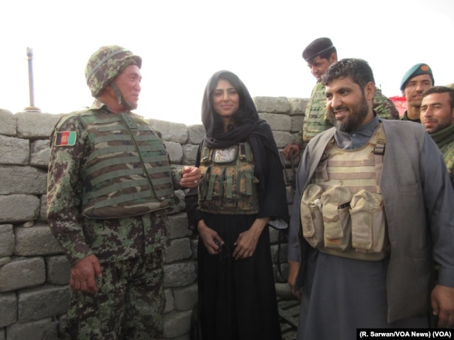 VOA journalist Ayesha Tanzeem visits a police checkpoint in Afghanistan’s Achin district with Colonel Jan Mohammad, left, a local Afghan National Army commander, and Zabihullah Zmaray, right, a Nangarhar provincial council member.