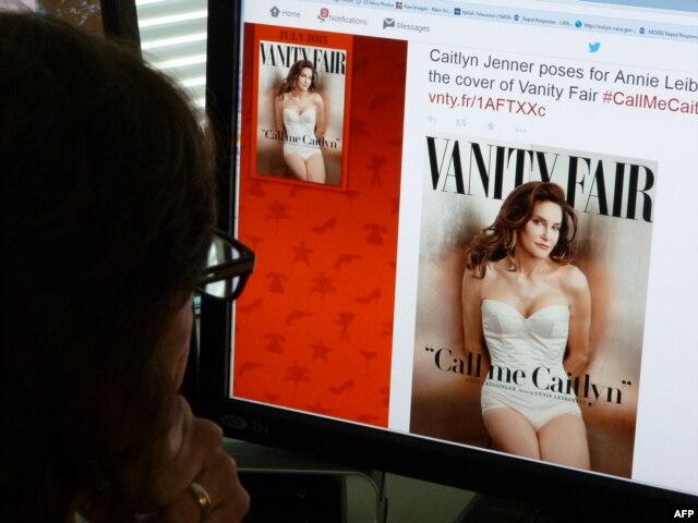 A journalist looks at Vanity Fair's Twitter site with the Tweet about Caitlyn Jenner, the transgender Olympic champion formerly known as Bruce, who will be featured on the July cover of the magazine, June 1, 2015.