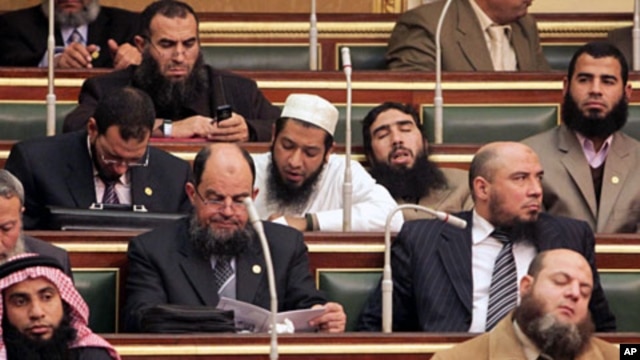 Salafi members of parliament are seen during the first Egyptian parliament session, after a revolution ousted former President Hosni Mubarak, in Cairo, January 23, 2012
