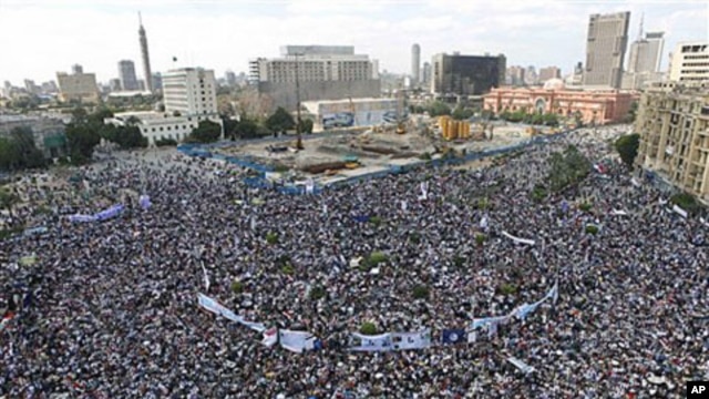 Thousands of Egyptians protest in Cairo's central Tahrir Square, the focal point of Egyptian uprising, as they hold banners and signs demanding prosecution of ousted president Hosni Mubarak and his regime Friday, April 8, 2011