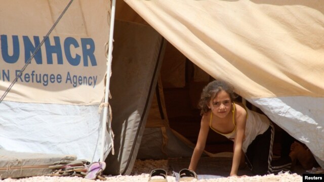 Một cô bé Syria tại trại tị nạn Al Zaatri ở thành phố Mafraq, Jordan, gần biên giới với Syria, 13/8/2012
