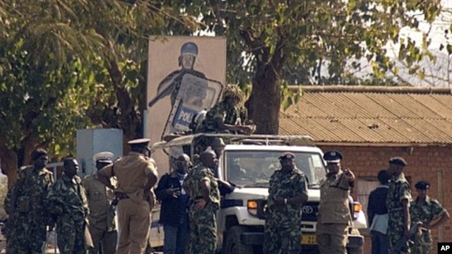 Malawi police patrol on a street of Lilongwe on July 20, 2011