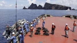 Workers on the city government of Tokyo's survey vessel prepare to survey around a group of disputed islands known as Senkaku in Japan and Diaoyu in China in the East China Sea September 2, 2012. The city government of Tokyo sent a ship to survey a group 