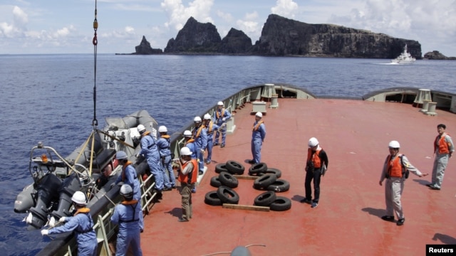 Workers on the city government of Tokyo's survey vessel prepare to survey around a group of disputed islands known as Senkaku in Japan and Diaoyu in China in the East China Sea September 2, 2012. The city government of Tokyo sent a ship to survey a group 