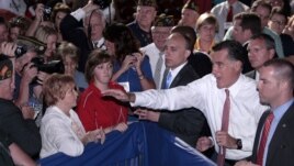 Republican presidential candidate, former Massachusetts Gov. Mitt Romney waves  to members of the Veterans of Foreign Wars after his speech at the VFW national convention in Reno, Nev. Tuesday July 24, 2012.