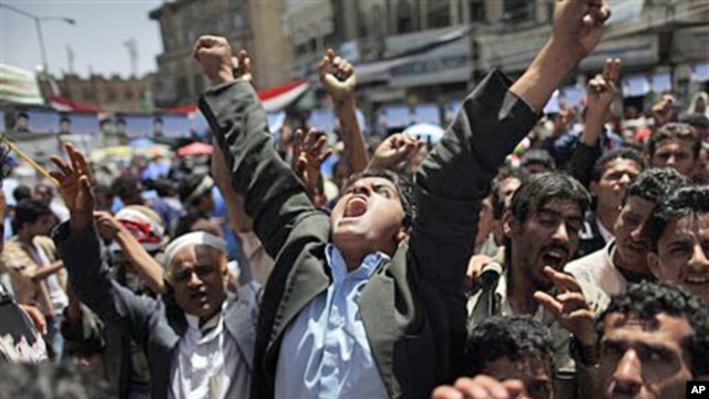 An anti-government protester reacts during a demonstration demanding the resignation of Yemeni President Ali Abdullah Saleh, in Sanaa, May 2 2011