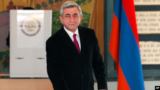 Armenian President Serge Sarkisian casts his ballot during presidential election in Yerevan, Armenia, Feb. 18, 2013.