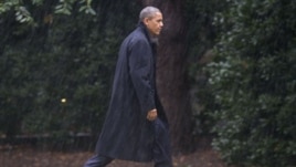 President Barack Obama walks toward White House after cancelling campaign rally, Washington, Oct. 29, 2012.