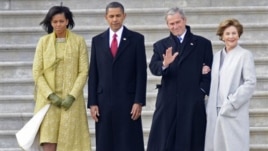 Michelle and Barack Obama walk with George W. Bush and wife, Laura, on Inauguration Day 2009